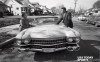 Muhammad Ali, then Cassius Clay (right), shows off a new pink Cadillac to his mother Odessa Clay (left). He bought the automobile for his parents following his first professional fight.  //  Credit: Jean A. Baron, The Courier-Journal, USA TODAY Sports