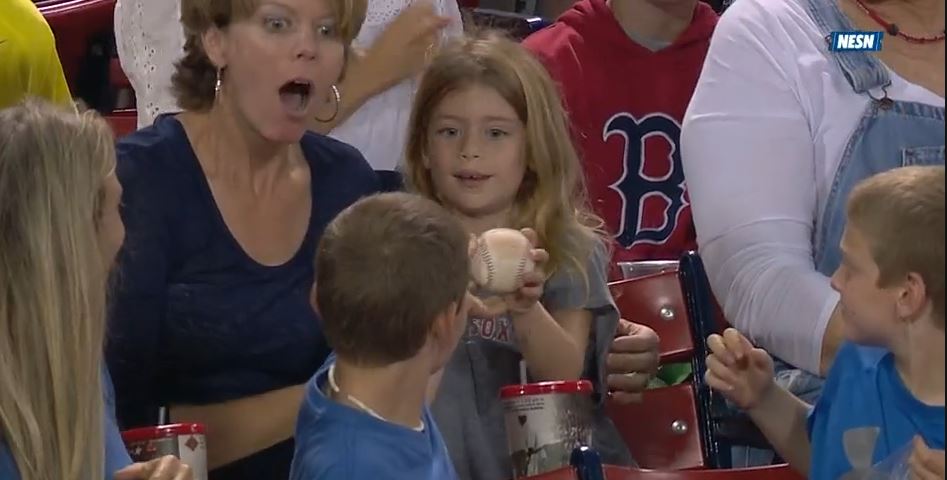 Suave little Red Sox fan gives away foul ball to the girl sitting