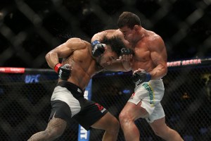 CLEVELAND, OH - SEPTEMBER 10: Brad Tavares punches Caio Magalhaes during the UFC 203 event at Quicken Loans Arena on September 10, 2016 in Cleveland, Ohio. (Photo by Rey Del Rio/Getty Images)