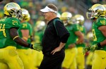 EUGENE, OR - SEPTEMBER 1: Head coach Chip Kelly of the Oregon Ducks talks to Kenjon Barner #24 during warm ups against the Arkansas State Red Wolves on September 1, 2012 at Autzen Stadium in Eugene, Oregon. Oregon won the game 57-34. (Photo by Craig Mitchelldyer/Getty Images)