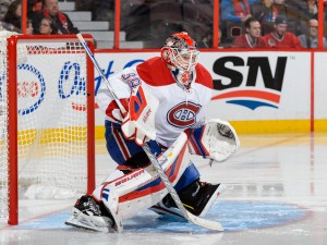 OTTAWA, ON - OCTOBER 11:  Goaltender Mike Condon #39 of the Montreal Canadiens protects his net and wins his first ever NHL game against the Ottawa Senators at Canadian Tire Centre on October 11, 2015 in Ottawa, Ontario, Canada. The Montreal Canadiens defeated the Ottawa Senators 3-1.  (Photo by Minas Panagiotakis/Getty Images)