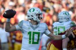 LOS ANGELES, CA - NOVEMBER 05: Justin Herbert #10 of the Oregon Ducks looks to pass against the USC Trojans at Los Angeles Memorial Coliseum on November 5, 2016 in Los Angeles, California. (Photo by Lisa Blumenfeld/Getty Images)
