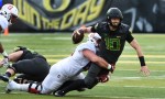 EUGENE, OR - NOVEMBER 12: Quarterback Justin Herbert #10 of the Oregon Ducks is tackled as he scrambles out of the pocket during the second quarter of the game against the Stanford Cardinal at Autzen Stadium on November 12, 2016 in Eugene, Oregon. (Photo by Steve Dykes/Getty Images)
