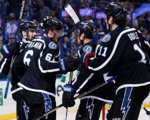 TAMPA, FL - NOVEMBER 12: Anton Stralman #6 of the Tampa Bay Lightning celebrates his goal with teammates Cedric Paquette #13, J.T. Brown #23, and Brian Boyle #11 against the San Jose Sharks during the third period at Amalie Arena on November 12, 2016 in Tampa, Florida. (Photo by Scott Audette/NHLI via Getty Images)