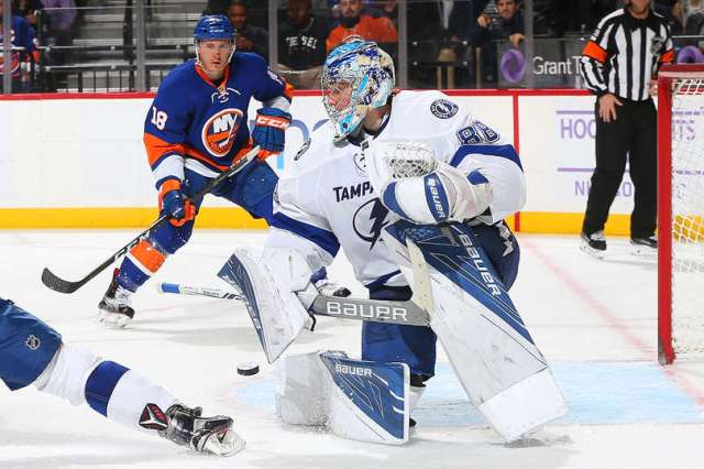 NEW YORK, NY - NOVEMBER 14: Andrei Vasilevskiy #88 of the Tampa Bay Lightning makes a save against the New York Islanders as Ryan Strome #18 of the New York Islanders looks on at the Barclays Center on November 14, 2016 in Brooklyn borough of New York City. (Photo by Mike Stobe/NHLI via Getty Images)