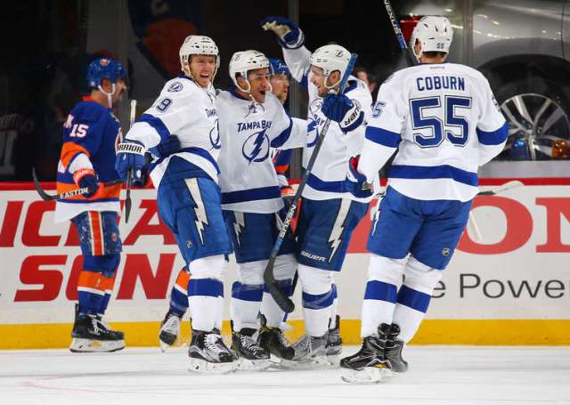 NEW YORK, NY - NOVEMBER 14: J.T. Brown #23 of the Tampa Bay Lightning celebrates his first period goal against the New York Islanders with teammates Braydon Coburn #55 and Slater Koekkoek #29 at the Barclays Center on November 14, 2016 in Brooklyn borough of New York City. (Photo by Mike Stobe/NHLI via Getty Images)