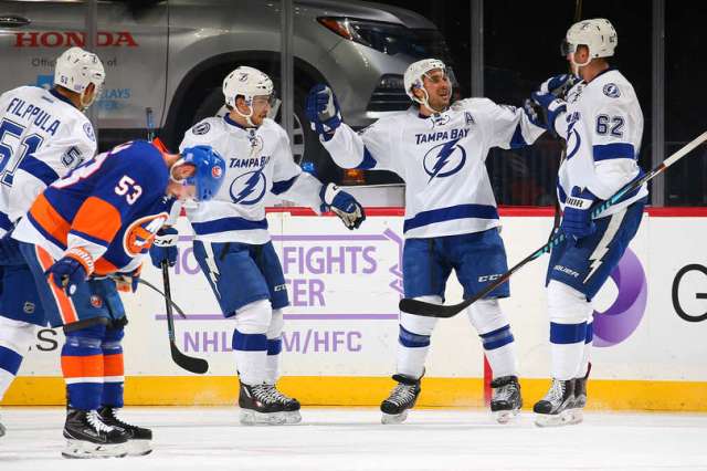 NEW YORK, NY - NOVEMBER 14: Ryan Callahan #24 of the Tampa Bay Lightning celebrates his first period goal against the New York Islanders with teammates Andrej Sustr #62 and Brayden Point #21 at the Barclays Center on November 14, 2016 in Brooklyn borough of New York City. (Photo by Mike Stobe/NHLI via Getty Images)