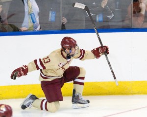 Johnny Gaudreau (BC - 13) celebrates his power-play goal. - The Boston College Eagles defeated the University of Minnesota Duluth Bulldogs 4-0 to win the NCAA Northeast Regional on Sunday, March 25, 2012, at the DCU Center in Worcester, Massachusetts.