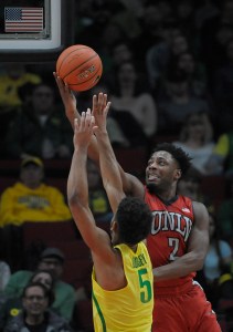 PORTLAND, OR - DECEMBER 17: Uche Ofoegbu #2 of the UNLV Rebels drives to the basket on Tyler Dorsey #5 of the Oregon Ducks during the first half of the game at Moda Center on December 17, 2016 in Portland, Oregon. The Ducks won the game 83-63. (Photo by Steve Dykes/Getty Images)