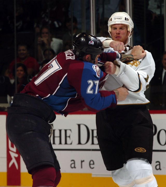 DENVER - SEPTEMBER 25: Scott Parker #27 of the Colorado Avalanche gets into a fight with Brad Winchester #16 of the Dallas Stars in the 1st period of preseason NHL action at the Pepsi Center on September 25, 2007 in Denver, Colorado. (Photo by Steve Dykes/Getty Images)