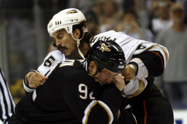 DALLAS - OCTOBER 20: Todd Fedoruk #92 of the Dallas Stars tangles with George Parros #16 of the Anaheim Ducks during the 1st period of of an NHL game at the American Airlines Center on October 20, 2007 in Dallas, Texas. (Photo by Layne Murdoch/Getty Images)