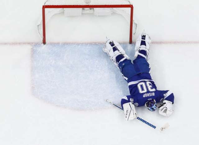 TAMPA, FL - DECEMBER 20: Goalie Ben Bishop #30 of the Tampa Bay Lightning lays on the ice against the Detroit Red Wings after getting injured during the first period at Amalie Arena on December 20, 2016 in Tampa, Florida. (Photo by Scott Audette/NHLI via Getty Images)