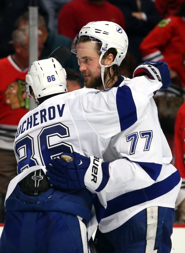 CHICAGO, IL - JUNE 08: Victor Hedman #77 celebrates with Nikita Kucherov #86 of the Tampa Bay Lightning after defeating the Chicago Blackhawks 3-2 in Game Three of the 2015 NHL Stanley Cup Final at the United Center on June 8, 2015 in Chicago, Illinois.  (Photo by Bruce Bennett/Getty Images)