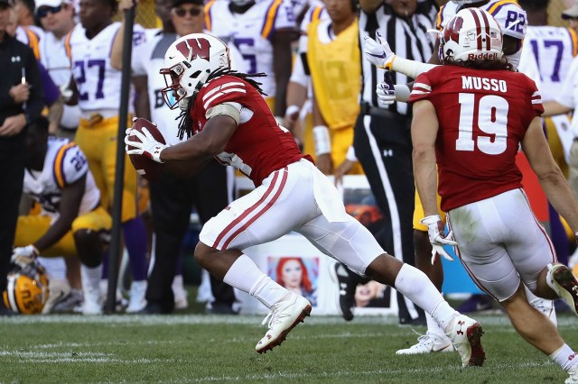 GREEN BAY, WI - SEPTEMBER 03: D'Cota Dixon #14 of the Wisconsin Badgers intercepts a pass thrown by Brandon Harris #6 of the LSU Tigers (not pictured) during the fourth quarter at Lambeau Field on September 3, 2016 in Green Bay, Wisconsin. (Photo by Jonathan Daniel/Getty Images)