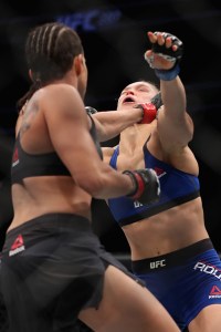 LAS VEGAS, NV - DECEMBER 30:  (L-R) Amanda Nunes of Brazil and Ronda Rousey face off in their UFC women's bantamweight championship bout during the UFC 207 event at T-Mobile Arena on December 30, 2016 in Las Vegas, Nevada.  (Photo by Christian Petersen/Getty Images)