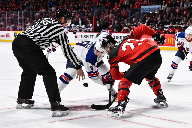 MONTREAL, QC - JANUARY 05: Luke Kunin #9 of Team United States and Anthony Cirelli #22 of Team Canada face-off during the 2017 IIHF World Junior Championship gold medal game at the Bell Centre on January 5, 2017 in Montreal, Quebec, Canada. (Photo by Minas Panagiotakis/Getty Images)