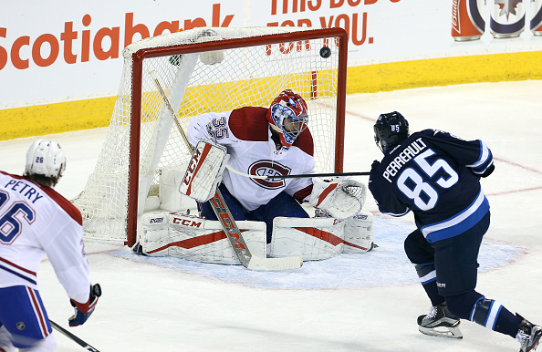 WINNIPEG, MANITOBA - JANUARY 11: Mathieu Perreault #85 of the Winnipeg Jets scores past Al Montoya #35 of the Montreal Canadiens during NHL action on January 11, 2017 at the MTS Centre in Winnipeg, Manitoba. (Photo by Jason Halstead /Getty Images)