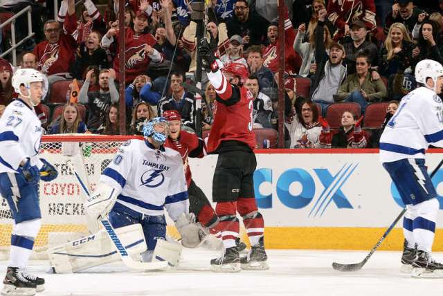 GLENDALE, AZ - JANUARY 21: Christian Fischer #36 of the Arizona Coyotes celebrates in front of goalie Ben Bishop #30 the Tampa Bay Lightning after scoring his first career NHL goal during the second period at Gila River Arena on January 21, 2017 in Glendale, Arizona. (Photo by Norm Hall/NHLI via Getty Images)