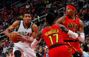 ATLANTA, GA - JANUARY 15:  Giannis Antetokounmpo #34 of the Milwaukee Bucks drives against Dennis Schroder #17 and Kent Bazemore #24 of the Atlanta Hawks at Philips Arena on January 15, 2017 in Atlanta, Georgia.  NOTE TO USER User expressly acknowledges and agrees that, by downloading and or using this photograph, user is consenting to the terms and conditions of the Getty Images License Agreement.  (Photo by Kevin C. Cox/Getty Images)