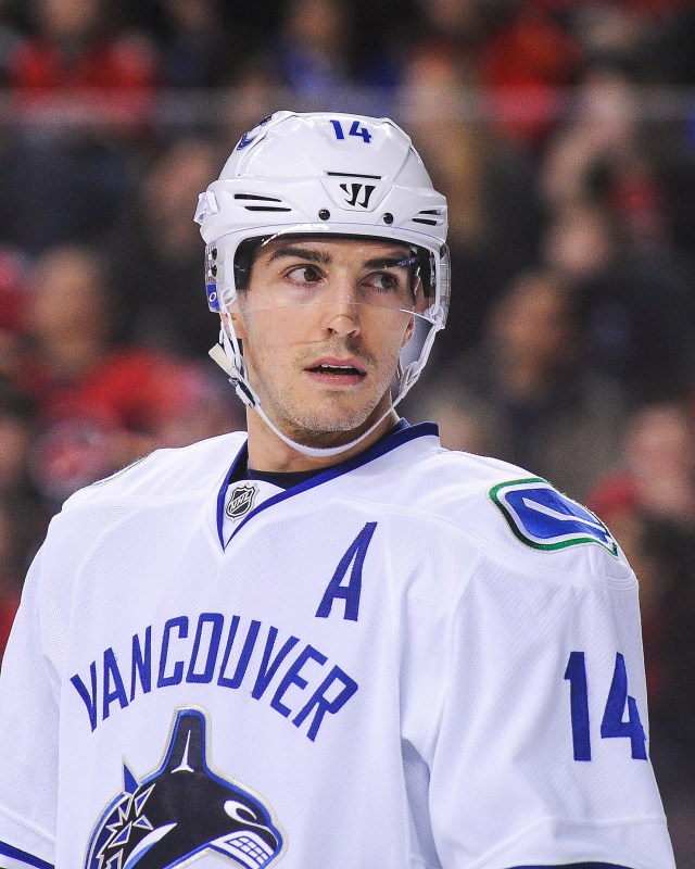 CALGARY, AB - DECEMBER 23: Alex Burrows #14 of the Vancouver Canucks in action against the Calgary Flames during an NHL game at Scotiabank Saddledome on December 23, 2016 in Calgary, Alberta, Canada. (Photo by Derek Leung/Getty Images)