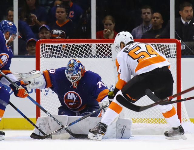 UNIONDALE, NY - SEPTEMBER 17: Kristers Gudlevskis #70 of the New York Islanders makes the first period save on Oskar Lindblom #54 of the Philadelphia Flyers during a preseason game at the Nassau Veterans Memorial Coliseum on September 17, 2017 in Uniondale, New York. (Photo by Bruce Bennett/Getty Images)