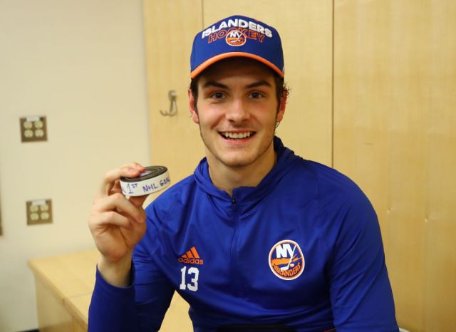 NEW YORK, NY - OCTOBER 19: Mathew Barzal #13 of the New York Islanders holds the puck with which he scored his first NHL goal against the New York Rangers at Madison Square Garden on October 19, 2017 in New York City. The Islanders defeated the Rangers 4-3 in the shootout. (Photo by Bruce Bennett/Getty Images)