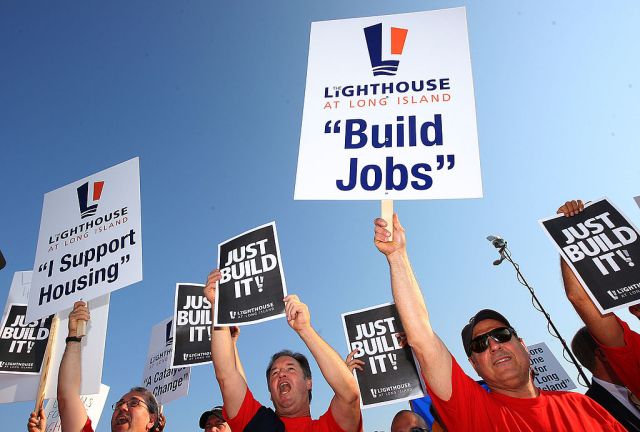 UNIONDALE, NY - AUGUST 04:  Members of Local 406 rally for support at Lot 8 of the Nassau Coliseum prior to marching to the Lighthouse project public hearing at the Adams Playhouse on the campus of Hofstra University on August 4, 2009  in Uniondale, New York.  (Photo by Mike Stobe/Getty Images)