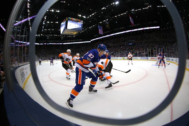 Sep 17, 2017; Uniondale, NY, USA; New York Islanders center Anders Lee (27) and Philadelphia Flyers defenseman Ivan Provorov (9) fight for the puck during the first period of a preseason game at NYCB Live at the Nassau Veterans Memorial Coliseum. Mandatory Credit: Brad Penner-USA TODAY Sports
