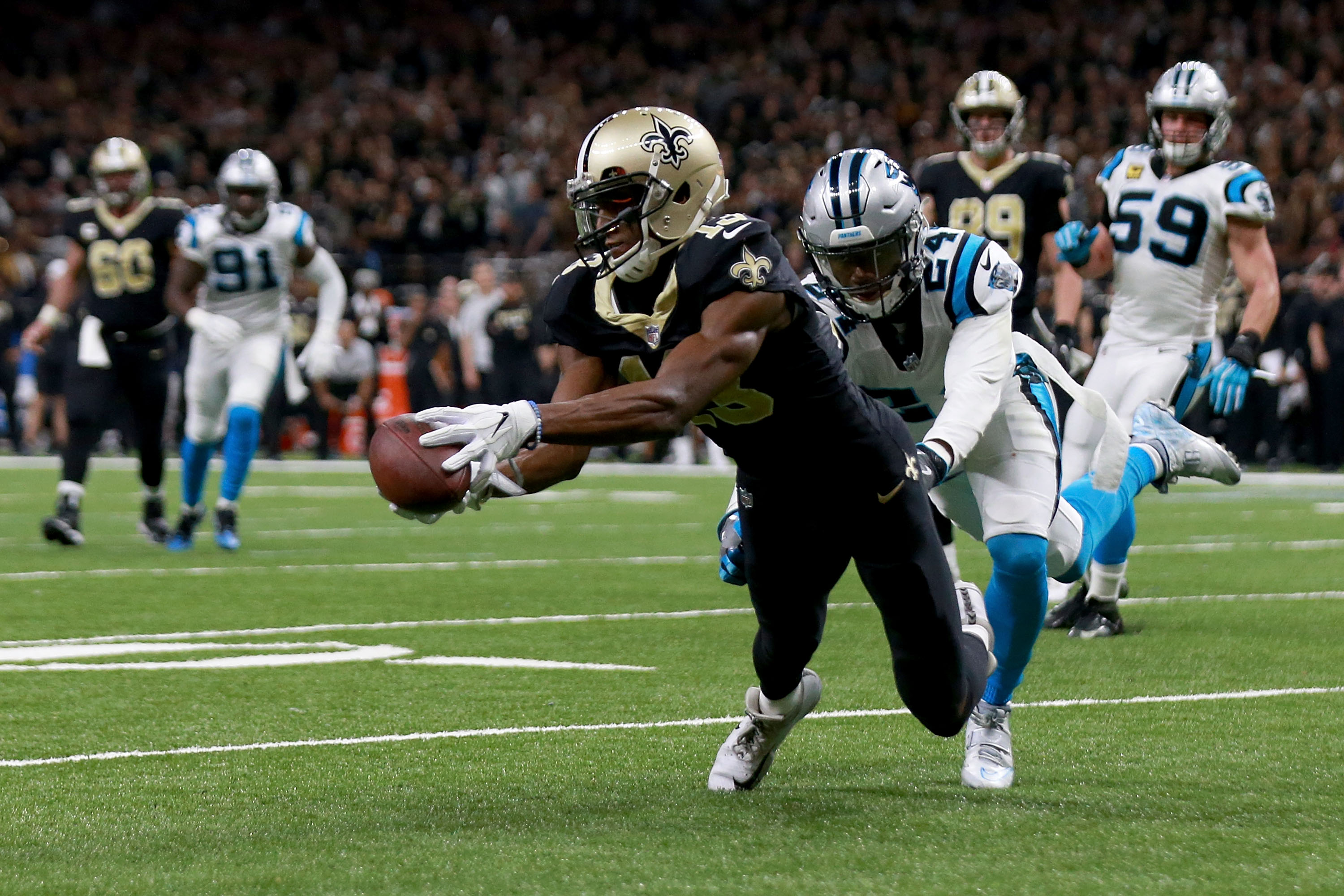 Saints survive, beat Panthers to advance