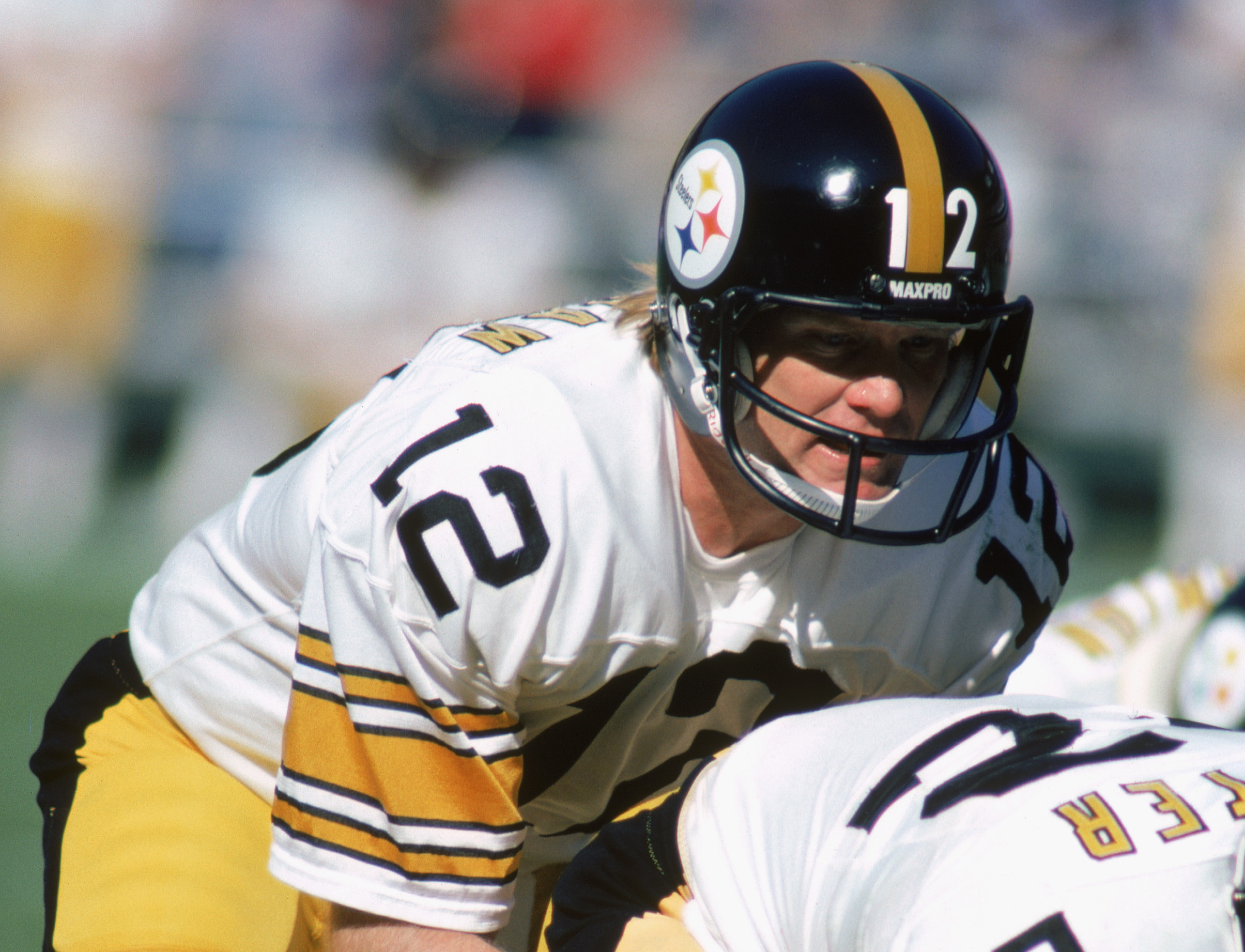 Pittsburgh Steeler rookie quarterback Terry Bradshaw picks up seven yards  against the Oakland Raiders, on Sept. 13, 1970 in Oakland, Calif. In the  third quarter of the game, the young pro quarterback