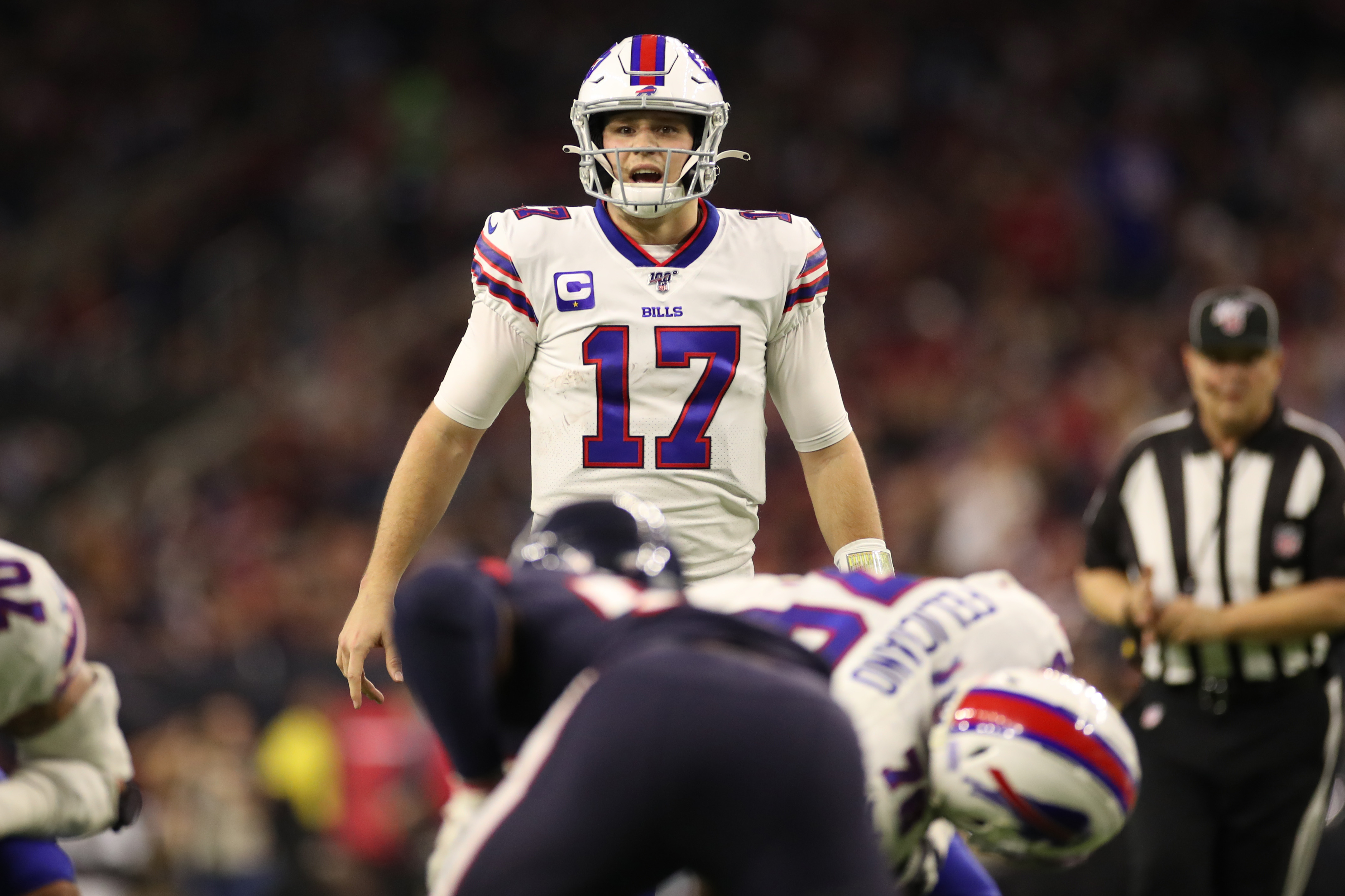 Buffalo Bills quarterback Josh Allen (17) raises his arms to