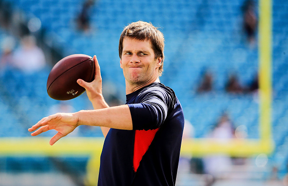 Tom Brady Number 12 of the New England Patriots warms up before the game against the Miami Dolphins at Sun Life Stadium on January 3, 2016 in Miami Gardens, Florida. (Photo by Mike Ehrmann/Getty Images)