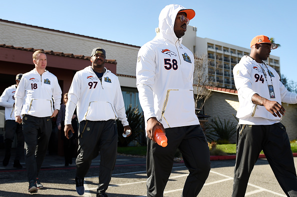 Denver Broncos quarterback Peyton Manning (18), defensive tackle Malik Jackson (97), linebacker Von Miller (58) and defensive end DeMarcus Ware (94) heading to the media tent to speak at the team hotel in Santa Clara, CA. February 01, 2016 (Photo by Joe Amon/The Denver Post via Getty Images)
