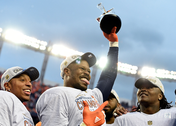 Outside linebacker Von Miller (58) of the Denver Broncos holds the AFC championship trophy with cornerback Chris Harris (25) of the Denver Broncos (left) and inside linebacker Danny Trevathan (59) of the Denver Broncos (right) after the Broncos defeated the Patriots 20 to 18 in the AFC championship game. The Denver Broncos played the New England Patriots in the AFC championship game at Sports Authority Field at Mile High in Denver, CO on January 24, 2015. (Photo by John Leyba/The Denver Post via Getty Images)