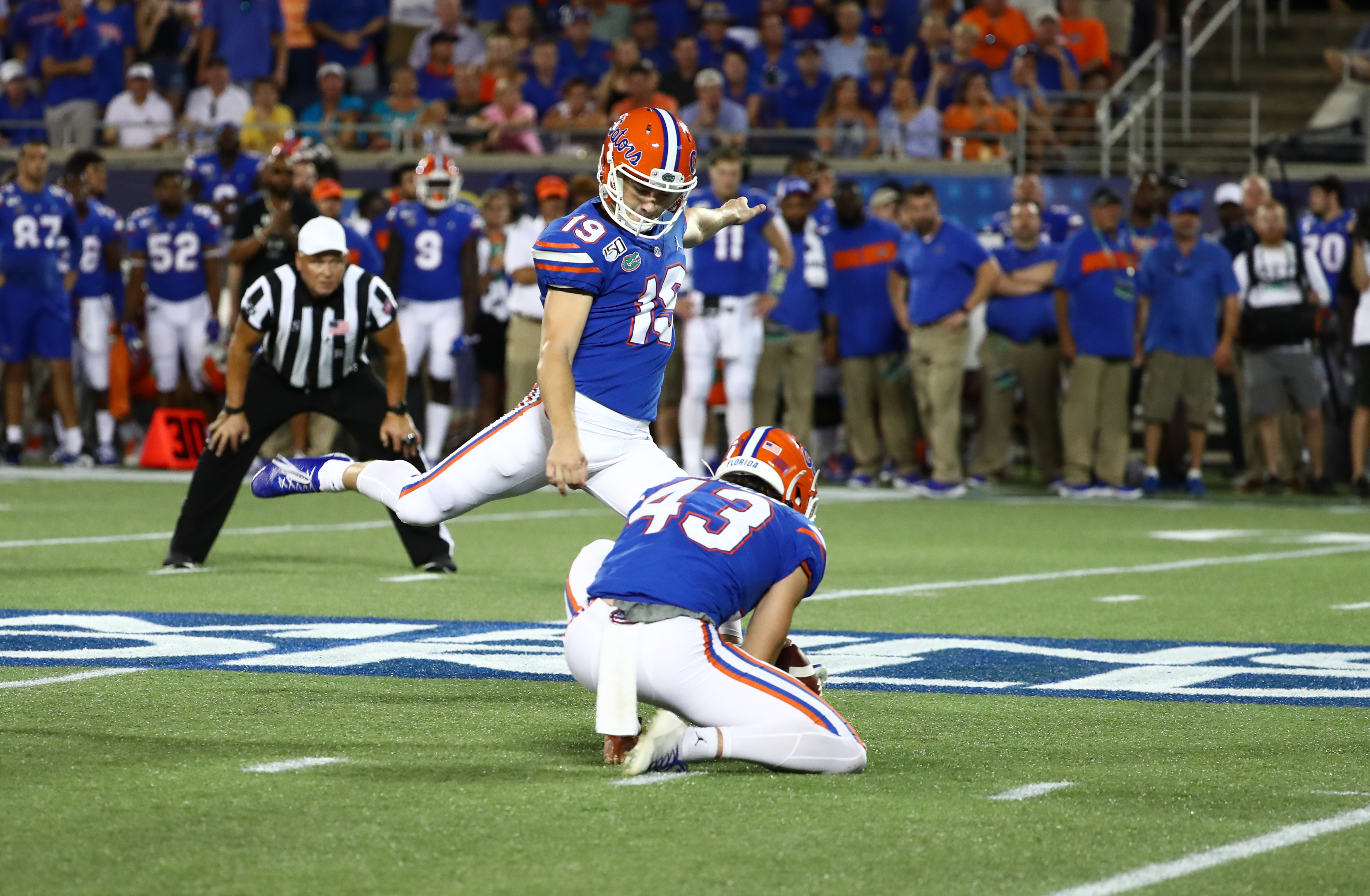 Nov 10 - Gainesville, FL, U.S.: Florida Gators place kicker Evan McPherson  (19) scores a PAT with Tommy Townsend holding during the second half of an  NCAA football game at against the