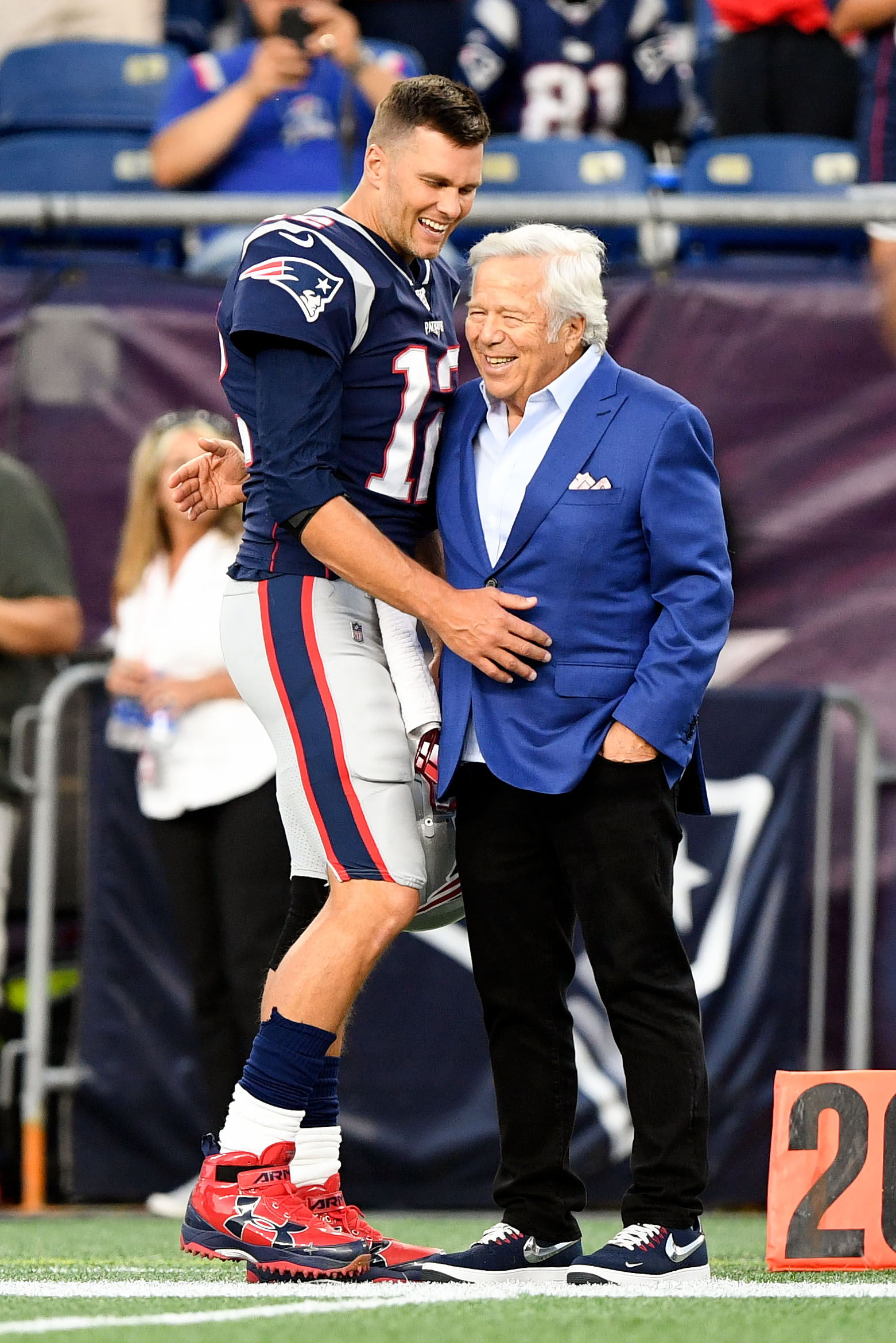 New England Patriots Tom Brady and head coach Bill Belichick smile on the  field during practice before the game against the New York Giants at Giants  Stadium in East Rutherford, New Jersey