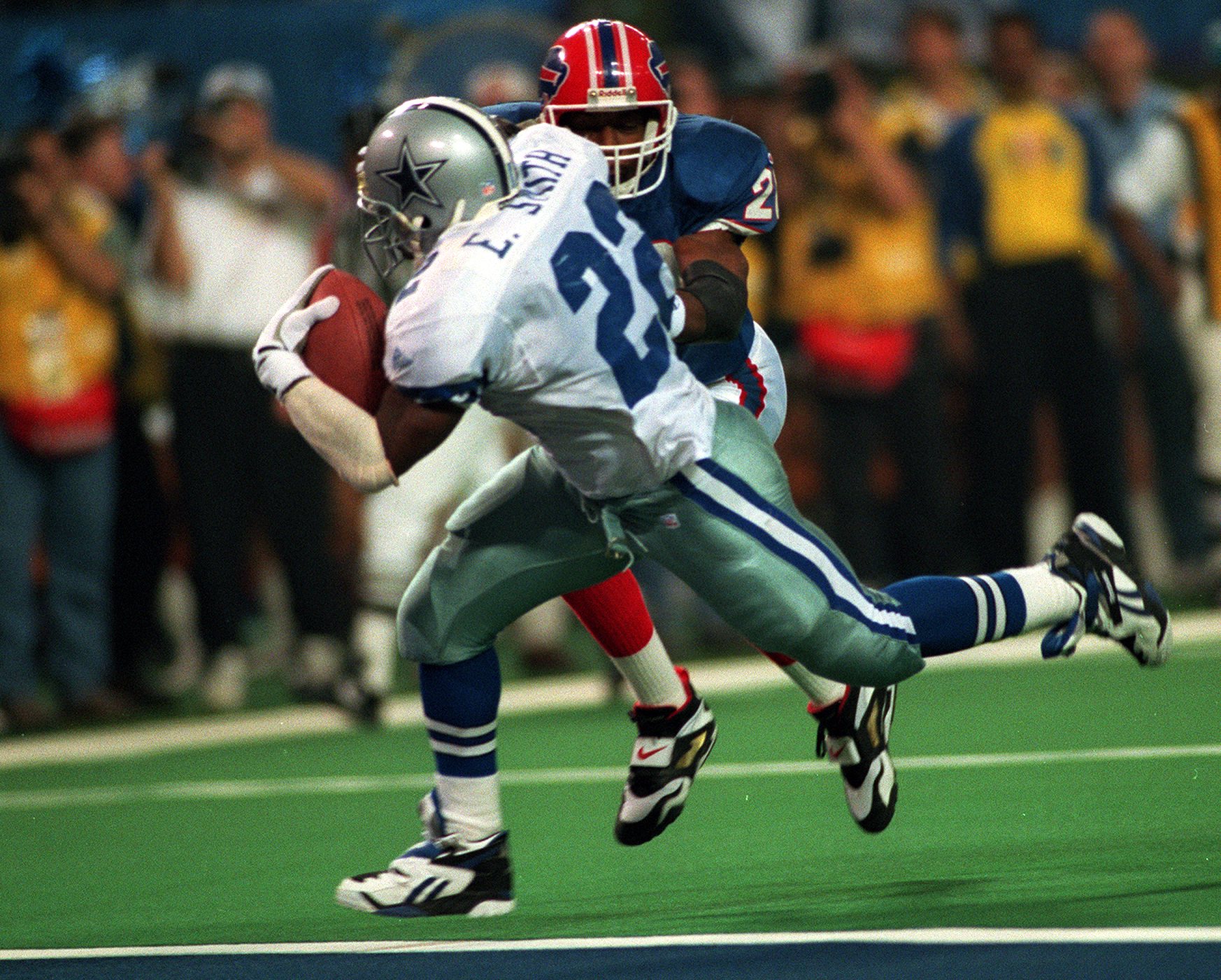 Dallas Cowboys' Emmitt smith (22) is congratulated by his goddaughter  Kendra, after the Cowboys beat the Bills 30-13, in Super Bowl XXVIII at the  Georgia Dome in Atlanta, Jan. 30, 1994. The