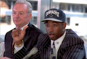 IRVING, TX - SEPTEMBER 11: Deion Sanders (R) talks to reporters at a press conference 11 September in Irving, Texas after the Dallas Cowboys signed him for "significant dollars." Cowboys owner Jerry Jones (L), who declined to release details of the contract said "Its a done deal." AFP PHOTO (Photo credit should read PAUL K. BUCK/AFP/Getty Images)
