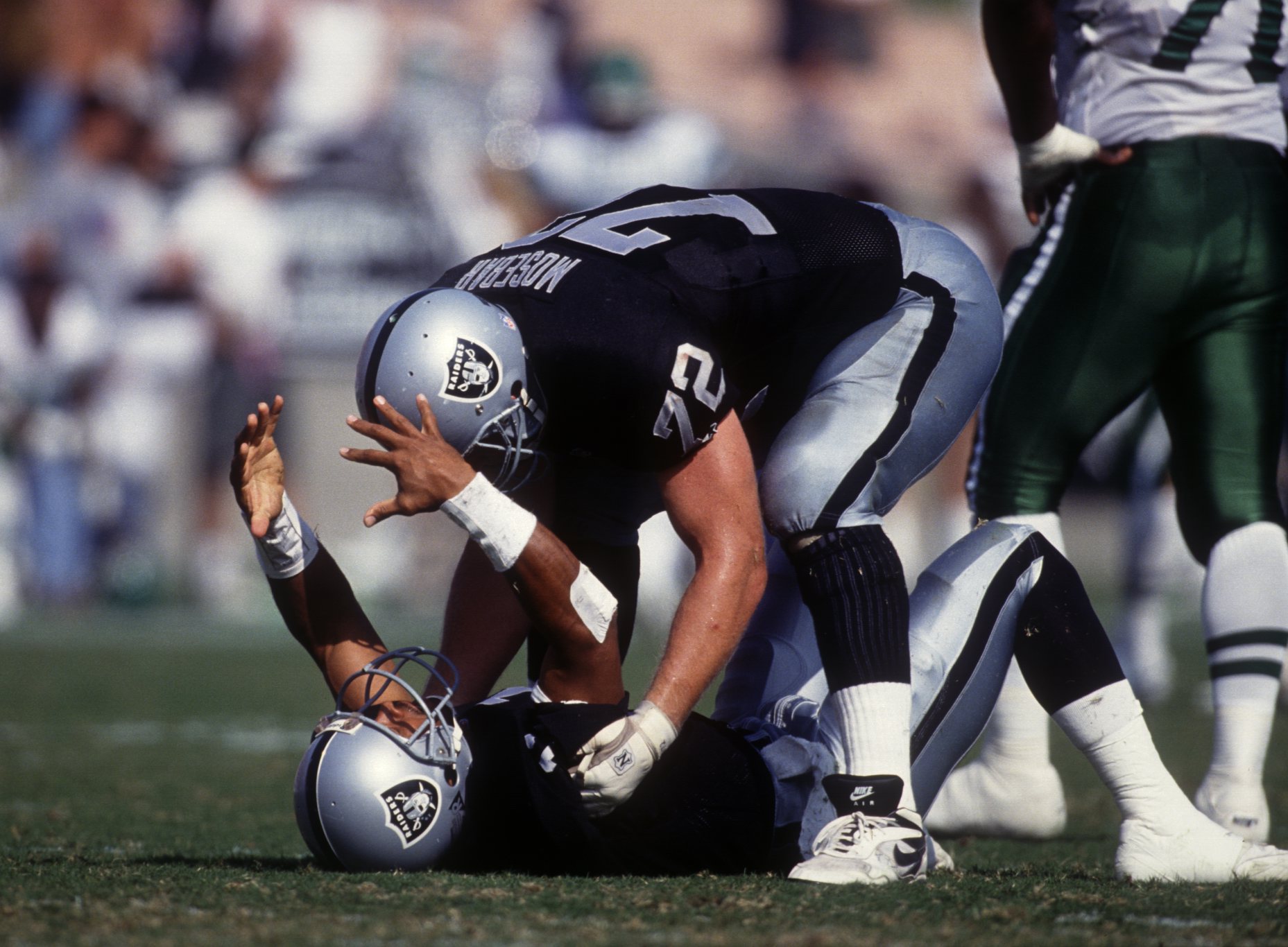 Oakland Raiders cornerback Terry McDaniel of the AFC team meets