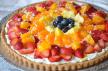 This refreshingly sweet Fresh Fruit Dessert Pizza with Coconut Cream has a sugar cookie base topped with a light and fluffy coconut cream cheese and delicious bites of fruit!