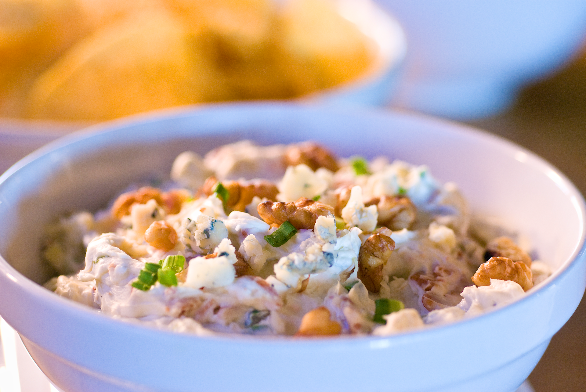 This macho dip requires a thick, sturdy chip! It is bursting with big bold flavors of smoky-sweet bacon, crumbled bits of tangy blue cheese and toasted walnuts. Serve it up warm with crunchy kettle-cooked potato chips. 