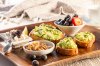 Our non-traditional continental breakfast board includes sprouted whole grain toast with ripe mashed avocado served with an assortment of fresh fruit (the tart tangy flavor of blueberries are particularly delicious paired with avocado), toasted walnuts and cheese.