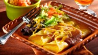 Bubbling-hot and delicious homemade enchiladas, hot from the oven in about 30 minutes. This easy-to-prepare recipe offers a great way to serve a comforting cheese enchilada dinner the whole family will enjoy–without spending all night in the kitchen. 