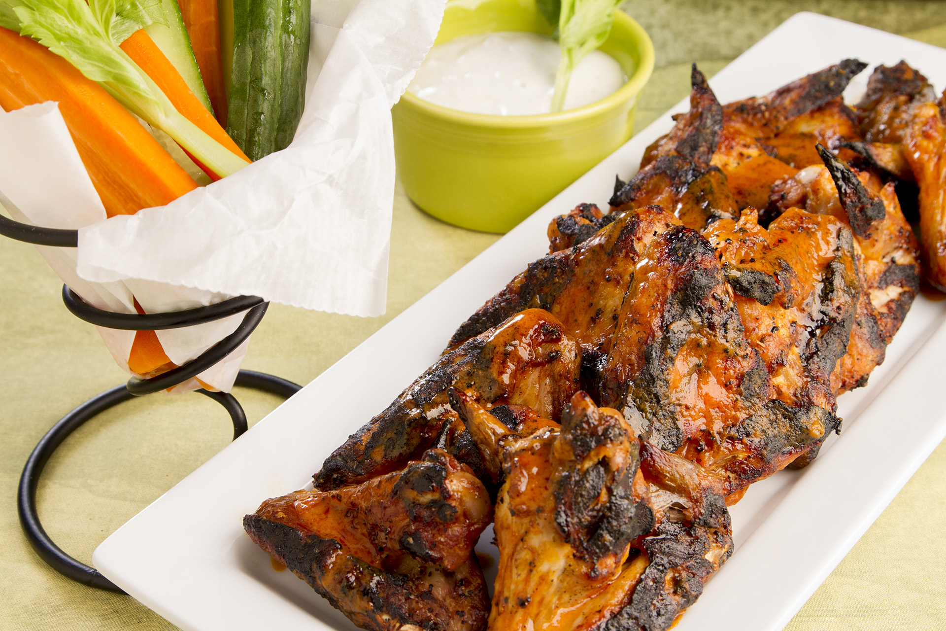 Grilled wings are a healthier alternative to fried wings, but just as satisfying. Use your favorite cayenne pepper sauce, and serve these with a chunky blue cheese dressing!