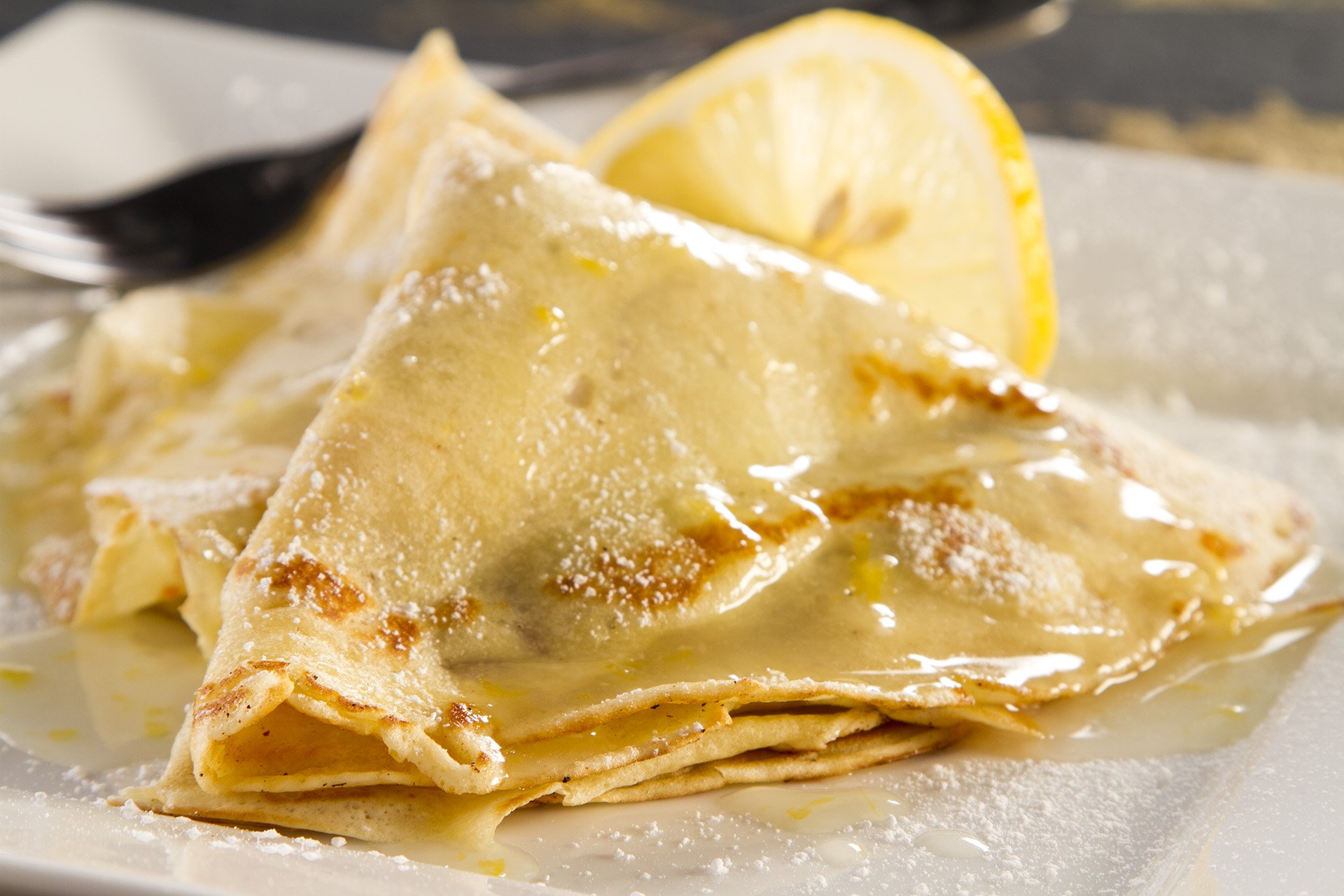 This is a homemade Lemon Sauce prepared with fresh lemon, grated lemon peel, butter, sugar and more. The Raspberry Crepe is an added bonus, but this Lemon Sauce would be great on any dessert.