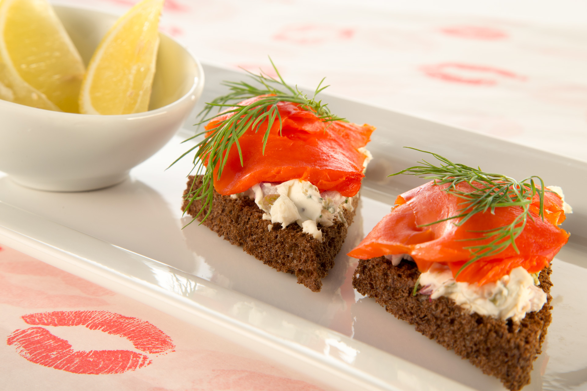 This smoked salmon dish–otherwise known as lox on pumpernickel–offers a classic combination of cream cheese, capers, red onions and smoked salmon. The perfect Valentine's Day appetizer!