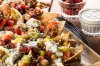 Own Your Party with this epic Greek nachos recipe using Aussie lamb! You'll get spicy Australian lamb served on fresh-baked pita chips with feta cheese, Mediterranean olive pico de gallo and tzatziki sauce.