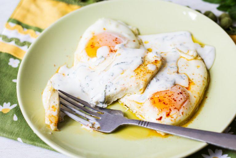 A traditional Lebanese breakfast, this Halloumi and Egg dish consists of halloumi cheese, perfectly enveloped by sunny-side-up eggs, and lightly drizzled with a mint yogurt dressing. Perfect, quick and simple. 