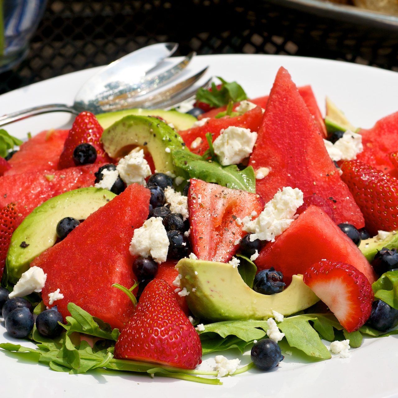 This fresh & flavorful summertime salad features the super food nutrition of fresh blueberries and avocado paired with wedges of sweet watermelon, mixed berries and fresh greens finished with crumbled feta cheese and a lively splash of seasoned rice vinegar. 