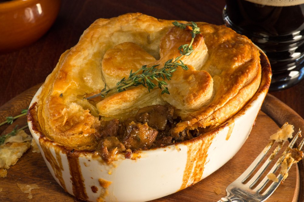 Beef and Guinness Stout Pie is a traditional Irish pub favorite that features creamy rich Guinness Stout-braised beef with caramelized mushrooms and fresh thyme.